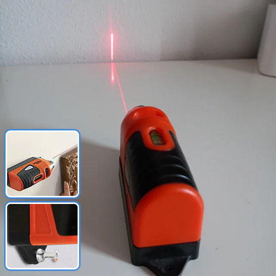 Niveau laser main en action visant mur horizontale verticale