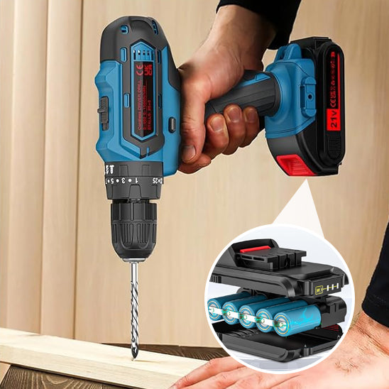une perceuse visseuse a percussion faisant trou sur bois et sa recharge