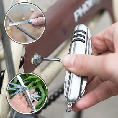 Couteau multi usages en action coupant branches tous ses elements grande photo serrant vice