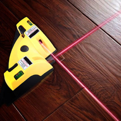 niveau laser revolution AK mesurant parquet bois